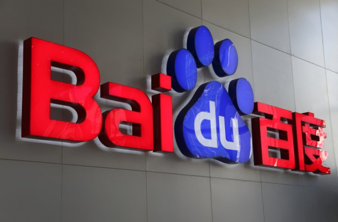 The Baidu Inc. logo is displayed in the reception are of the company's headquarters in Beijing, China, on Wednesday, Nov. 12, 2014. While Beijing-based Baidu, owner of China's most-used search-engine, is available around the world, more than 99 percent of its revenue comes from China. Photographer: Tomohiro Ohsumi/Bloomberg via Getty Images