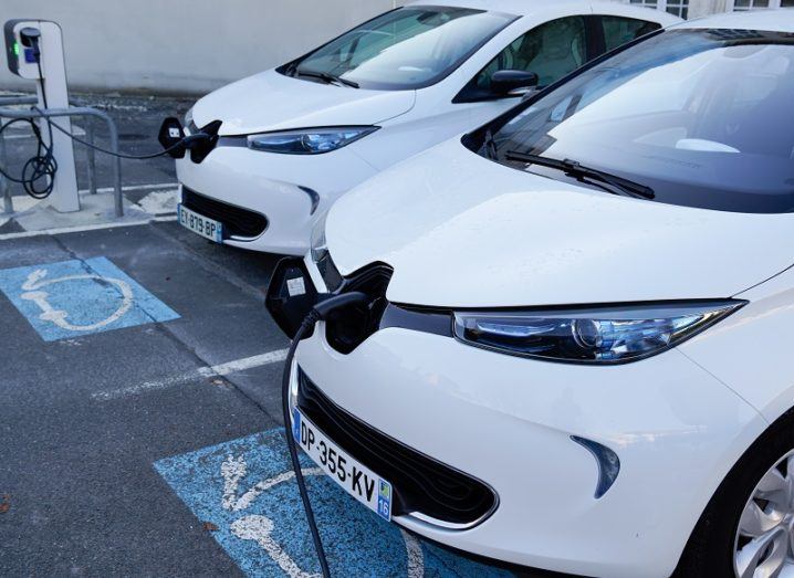 Two Renault Zoe EVs at a charging station in France.