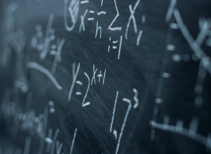 Maths formulae on a chalkboard.