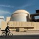 In this Oct. 26, 2010, file photo, a worker rides a bicycle in front of the reactor building of the Bushehr nuclear power plant, just outside the southern city of Bushehr. Iran said Friday, May 29, 2020, its experts would continue nuclear development activities, despite sanctions imposed earlier this week on their fellow scientists by the United States.