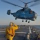 Boatswain’s Mate 3rd Class Jennifer Sahley salutes as a Ukrainian navy Ka-27 Helix helicopter takes off from the Arleigh Burke-class guided-missile destroyer USS Ross (DDG 71) during exercise Sea Breeze 2014 in the Black Sea.
