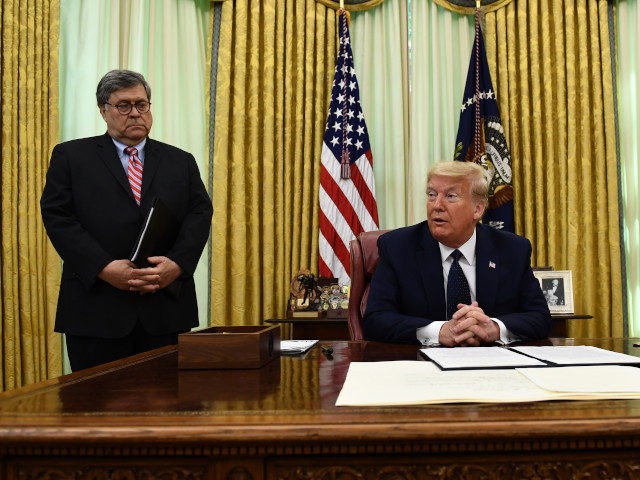 US President Donald Trump speaks as US Attorney General William Barr listens before signing an executive order on social-media companies in the Oval Office of the White House on May, 28, 2020. (Photo by Brendan Smialowski / AFP) (Photo by BRENDAN SMIALOWSKI/AFP via Getty Images)