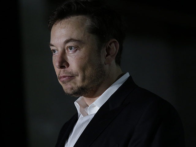 CHICAGO, IL - JUNE 14: Engineer and tech entrepreneur Elon Musk of The Boring Company listens as Chicago Mayor Rahm Emanuel talks about constructing a high speed transit tunnel at Block 37 during a news conference on June 14, 2018 in Chicago, Illinois. Musk said he could create a 16-passenger …