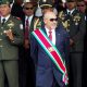 In this Aug. 12, 2015 file photo, Suriname President Desire "Desi" Delano Bouterse observes a military parade, after being sworn in for his second term, in Paramaribo, Suriname. The president stands a fair chance of holding onto power as the small South American nation elects a new National Assembly on Monday, May 25, 2020, a body that will choose the next president in August.