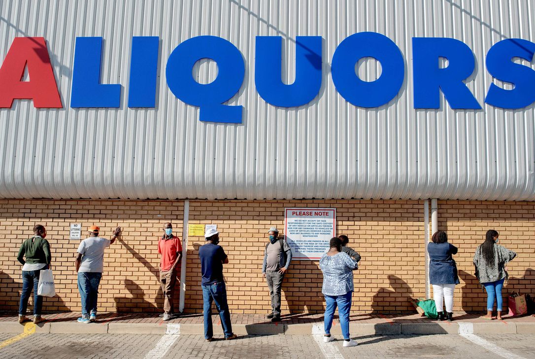 People queue outside a liquor store at the Alexandra mall, in Alexandra, Johannesburg, South Africa. The relaxation of the alcohol ban in South Africa came as a relief to many, who chose restocking their liquor cabinets instead of going straight to work on the day much of the country’s economy also reopened.