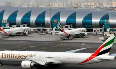In this March 22, 2017, file photo, an Emirates plane taxis to a gate at Dubai International Airport in Dubai, United Arab Emirates. The Middle East's biggest carrier, Emirates, declared on Sunday, May 10, 2020, higher profits of $288 million over the past year even as revenue declined due to flight suspensions sparked by the coronavirus, offering a glimpse of the financial toll now facing airlines around the world.