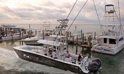 In this photo provided by the Florida Keys News Bureau, Captain Chase Fulton takes guest fishing in the Florida Keys on his chartered sportfishing boat Monday, June 1, 2020, in Islamorada, Fla.