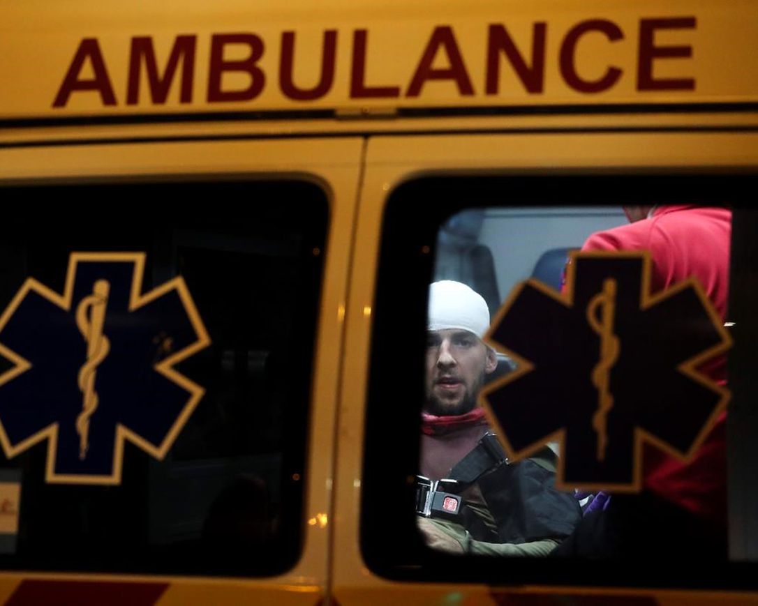 Jordon Coury, 24, gets medical attention in the back of the ambulance after he was struck in the back of the head with a rubber bullet as protesters and police faced off in downtown Tampa, Fla., Sunday, May 31, 2020.