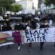 Protesters demonstrate Sunday in Boston, over the death of George Floyd, a black man who was in police custody in Minneapolis. Floyd died after being restrained by Minneapolis police officers on Memorial Day.