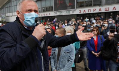 In this file photo taken on Sunday, May 24, 2020, an opposition activist Nikolai Statkevich, wearing a face mask to protect against coronavirus, gestures as he speaks to people gathered to sign up and support potential presidential candidates in the upcoming presidential elections in Minsk, Belarus. On Sunday, Nikolai Statkevich, one of Belarus' most prominent opposition figures, was detained while heading for a protest in Minsk.