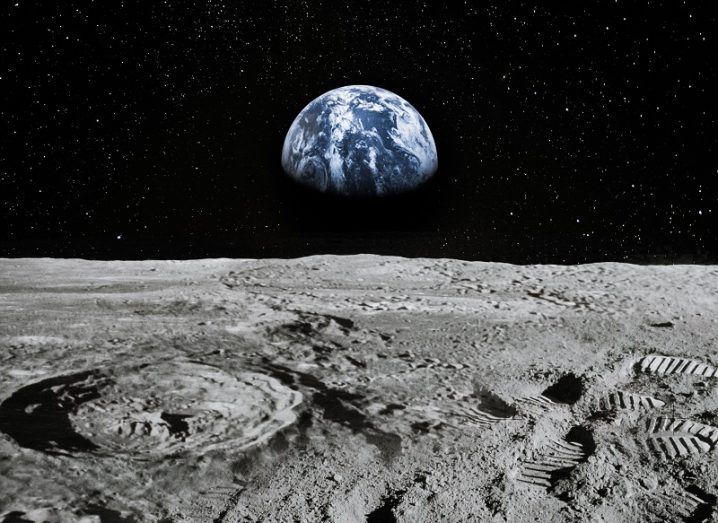 Render of the surface of the moon with the Earth visible in the distance.