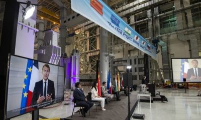 Panel at the launch of the ITER's assembly phase with Emmanuel Macron on large TV screens.