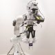 The robot arm built with artificial skin against a white background.